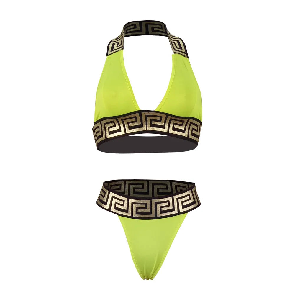 Printed bikini two piece set in polyester, available in yellow, red, black, green, and blue. Wire-free, unpadded design for swimming and wading. Sizes S-XL.