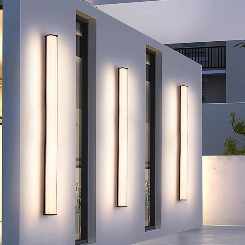 Modern outdoor wall lamp shown mounted on exterior wall, available in five size options for villa and hotel lighting