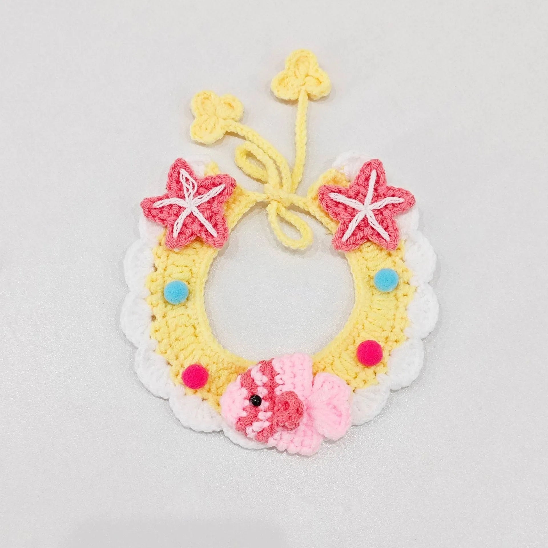 Hand-woven wool cat collar with cartoon Underwater World pattern in blue, size example on a light background