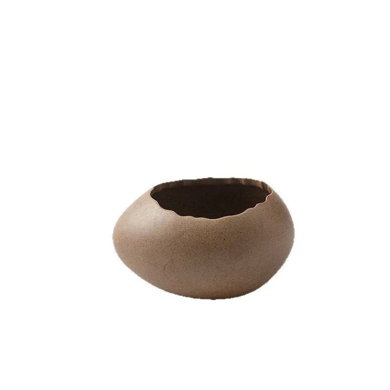 Creative egg shell shaped porcelain bowl in horizontal orientation with underglaze finish, modern simple style