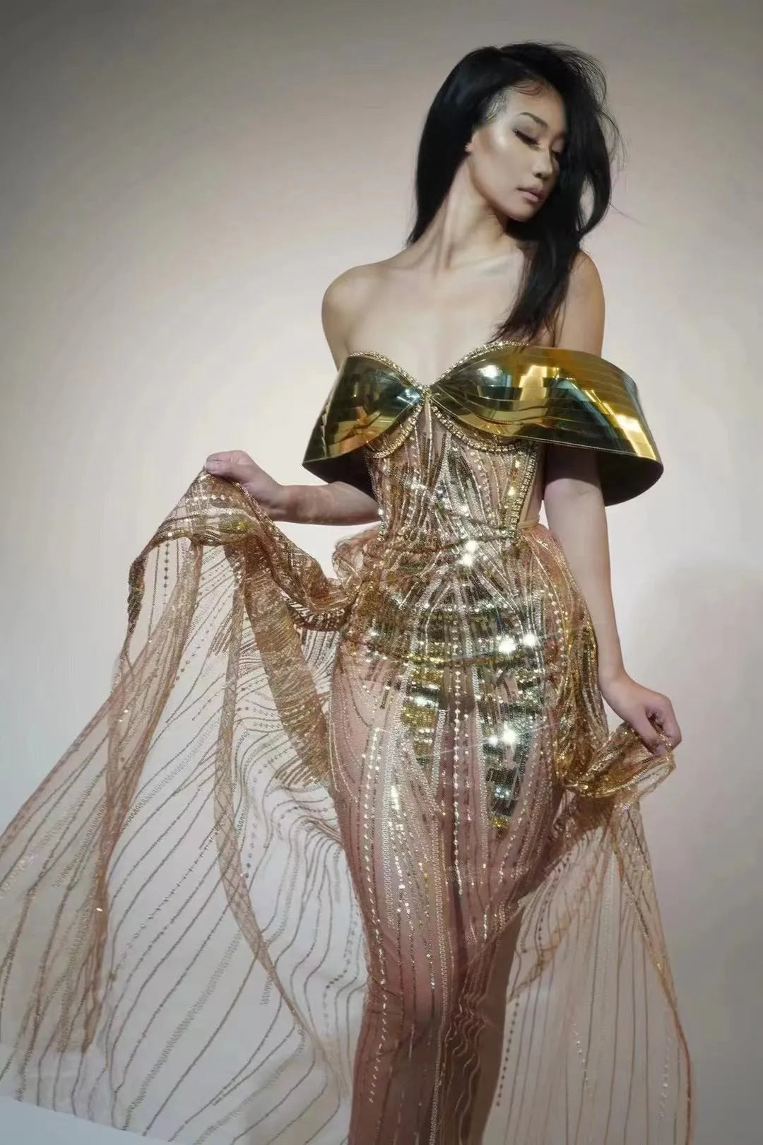 Gold strapless sequined dress with tulle skirt and high-leg split, sleeveless tube top design