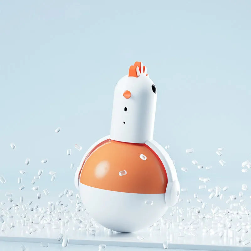 Green electric cat toy chicken with laser light feature on flat surface