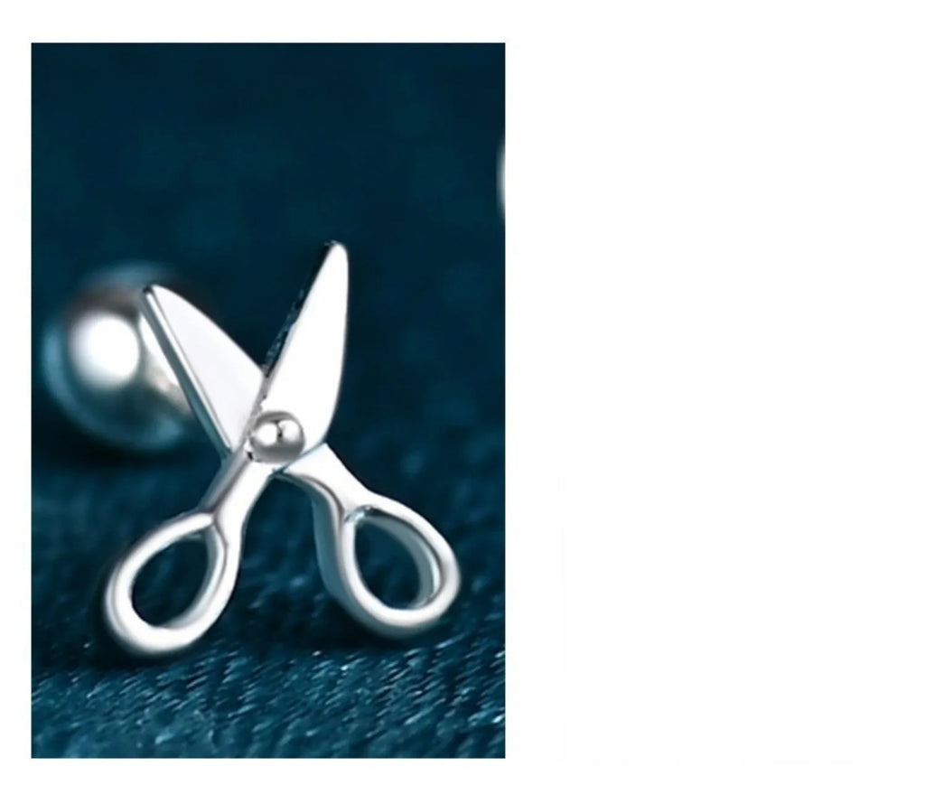 A pair of pure silver screw-back earrings for women with a mini scissors design on the fastening.