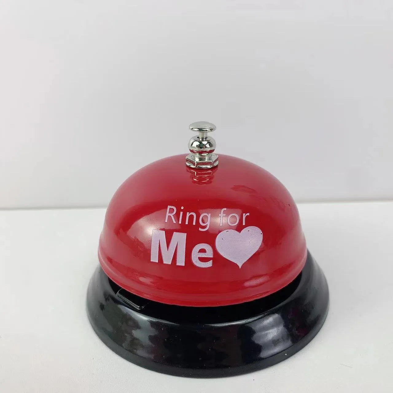 Iron game bell shown in one of ten available colours: blue, green, pink, red, yellow, green tea, or rose kiss.