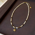 Close view of titanium steel starfish pendant necklace with natural shell and tigereye bead on a woman, Maillard colour, 41-50cm chain