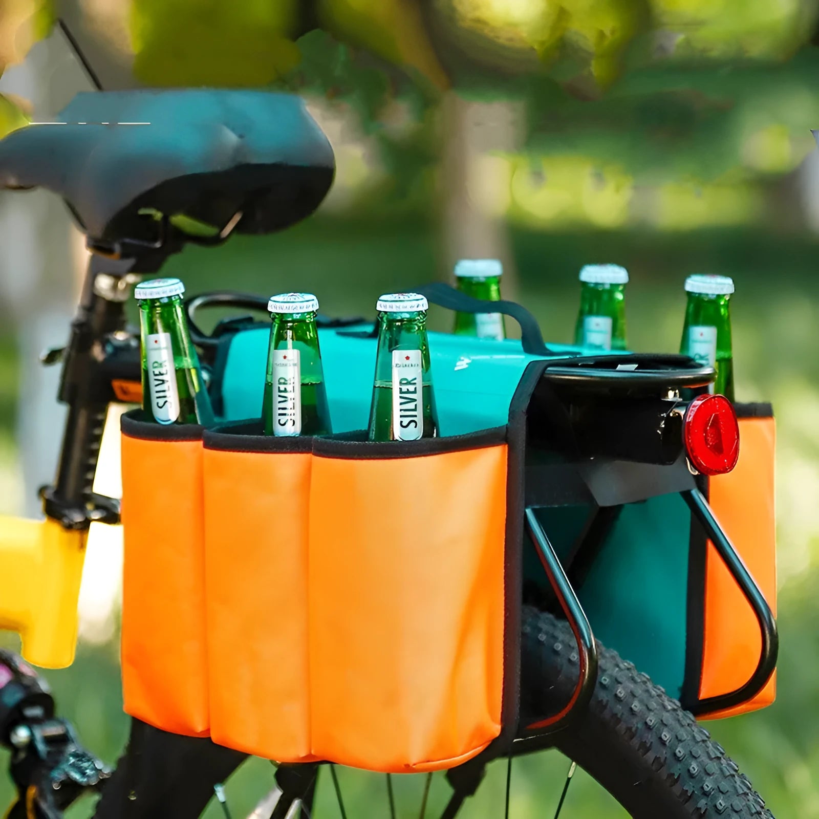Black and orange double-sided bicycle drink storage bag mounted on a bike rack.