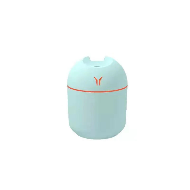 Round desktop humidifier in ivory white colour with USB cable and water tank showing 250ml capacity