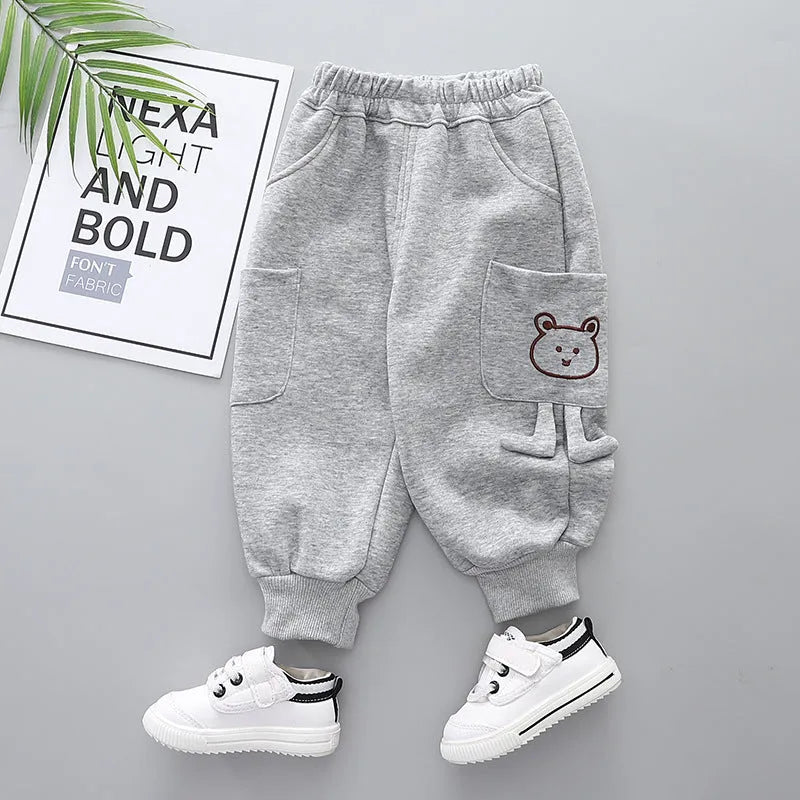Boys' velvet sport pants in gray, green, and brown with elastic waistband and drawstring
