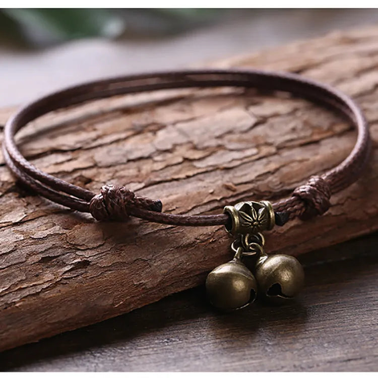 Nylon rope dog collar with a brass bell, shown in black, red, and coffee colour options.