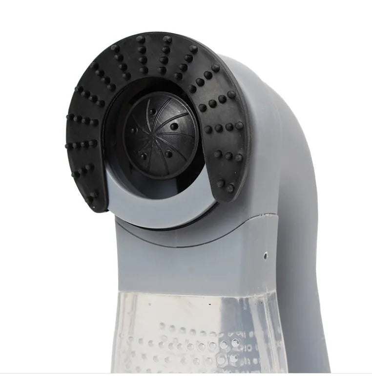 Grey handheld electric pet hair remover vacuum brush with soft rubber head.