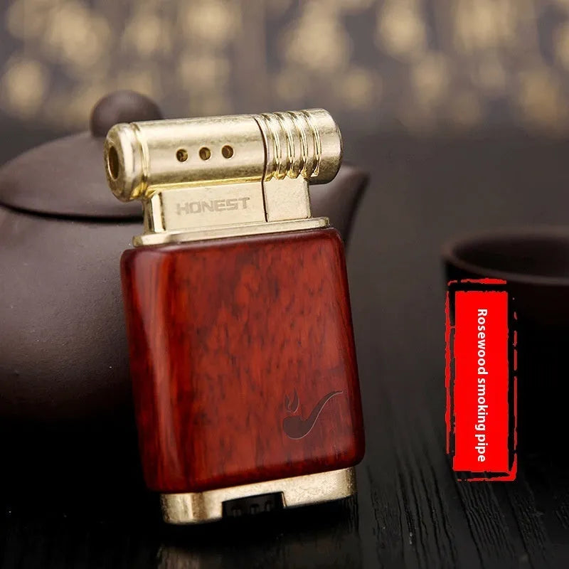 Black wood gas lighter with rosewood decorative finishes including sun face design
