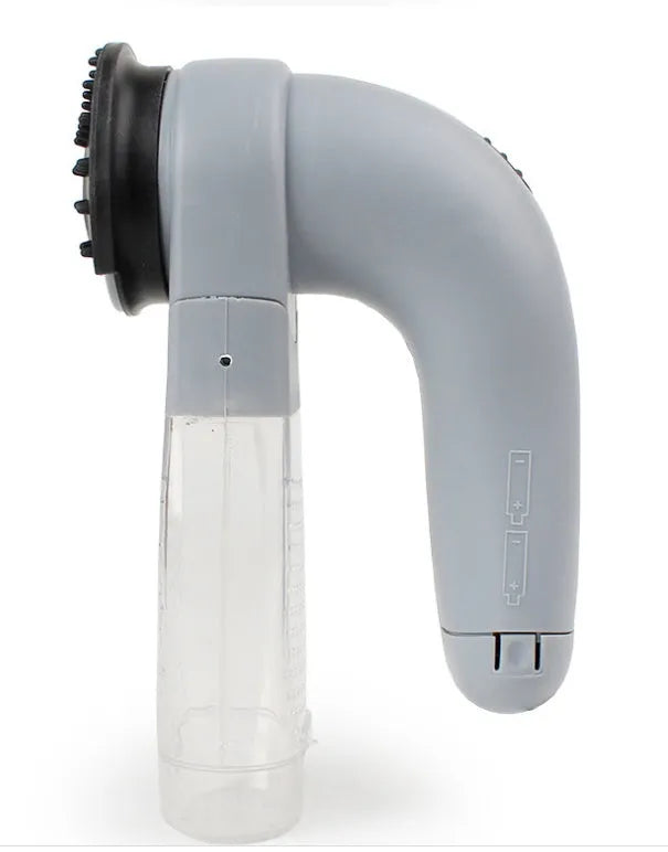 Grey handheld electric pet hair remover vacuum brush with soft rubber head.