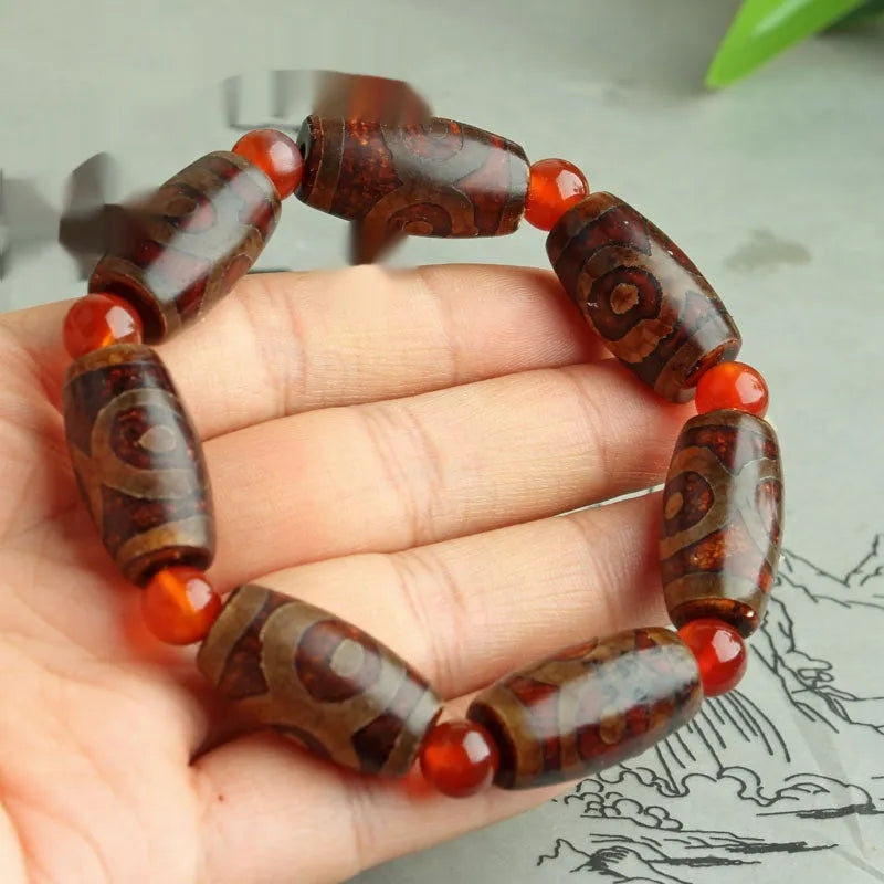 Distressed agate Tibet beads bracelet with three eye dzi design and polished stone beads