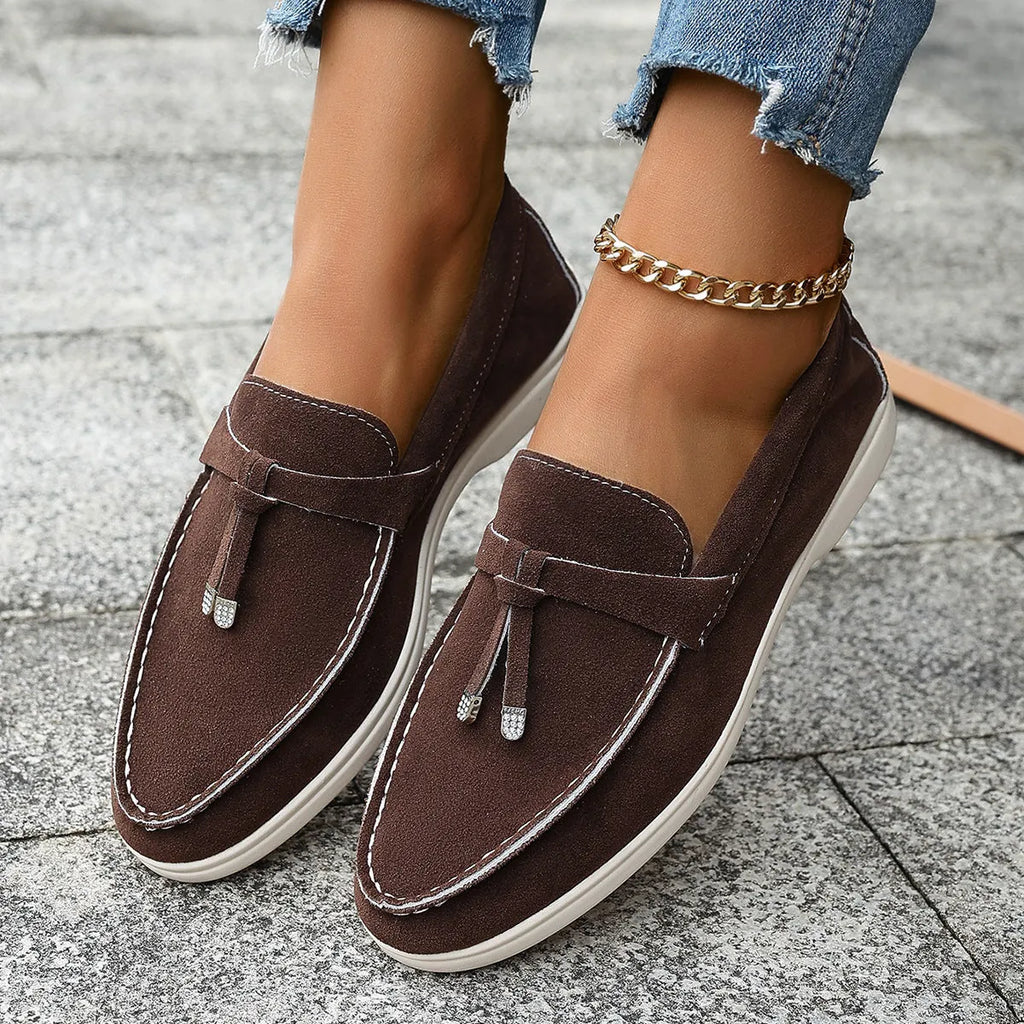 Women's casual tassel one pedal loafers in brown with round toe and low flat heel on a white background