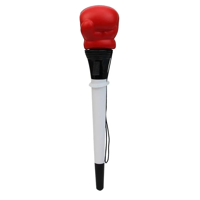 Four black boxing press ejection pens with a bullet-shaped 0.7mm tip on a desk.