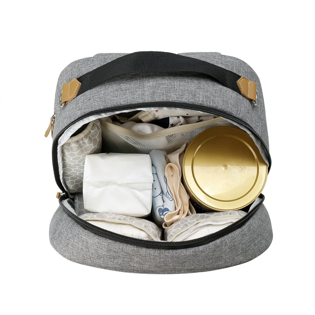 Grey insulated mother and child travel backpack with curved shoulder straps showing interior organisational compartments
