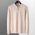 Man wearing a milky white pure wool sweater with a diamond lattice pattern and a half-zip front.