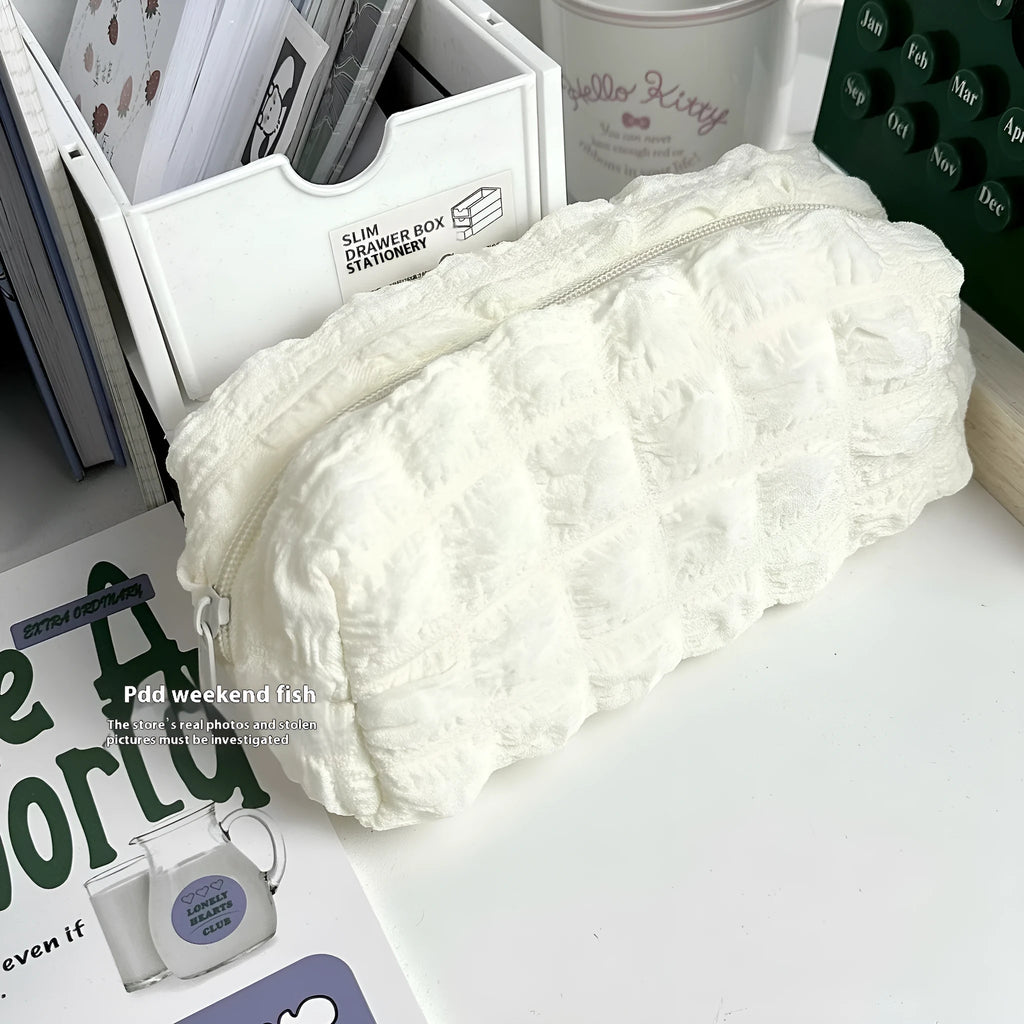 Cream puff fabric pencil case in beige or black colour for stationery organisation