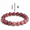 Natural strawberry quartz bracelet with geometric beads in starlight cherry red colour on wrist