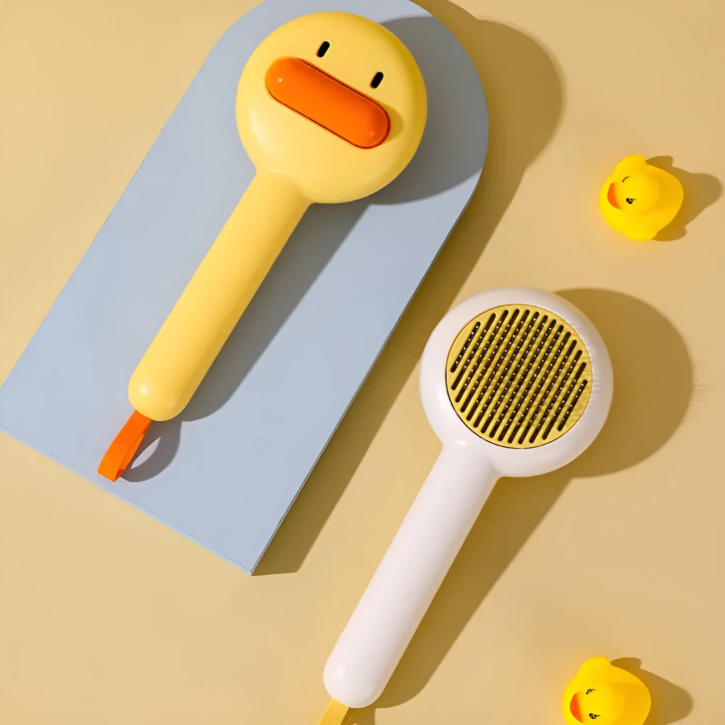 Small yellow duck comb brush for pet hair removal with open-section needle design