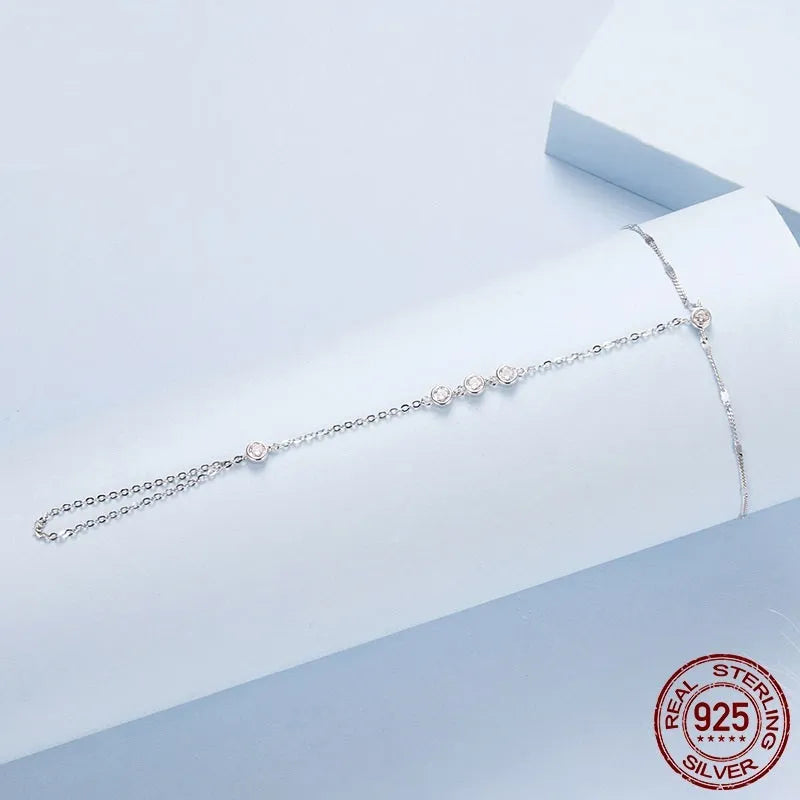 S925 sterling silver tassel bracelet with integrated ring and chain, shown in silver or gold electroplated finish