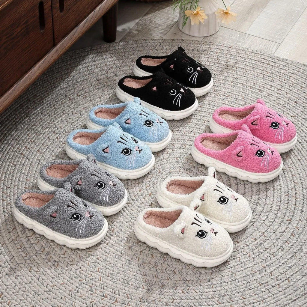 Winter cartoon cat fluffy slippers with plush upper and non-slip EVA sole, in black, white, pink, or grey.