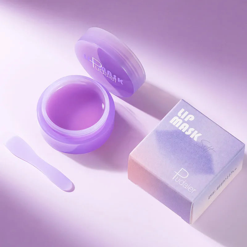 Box containing a lip exfoliating balm and a silicone scraper tool for lip care treatment