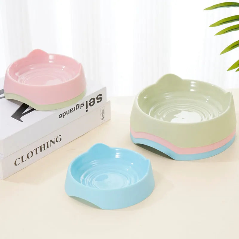 Ceramic dog slow feeder puzzle bowl in blue with non-slip base, shown in S and L sizes.