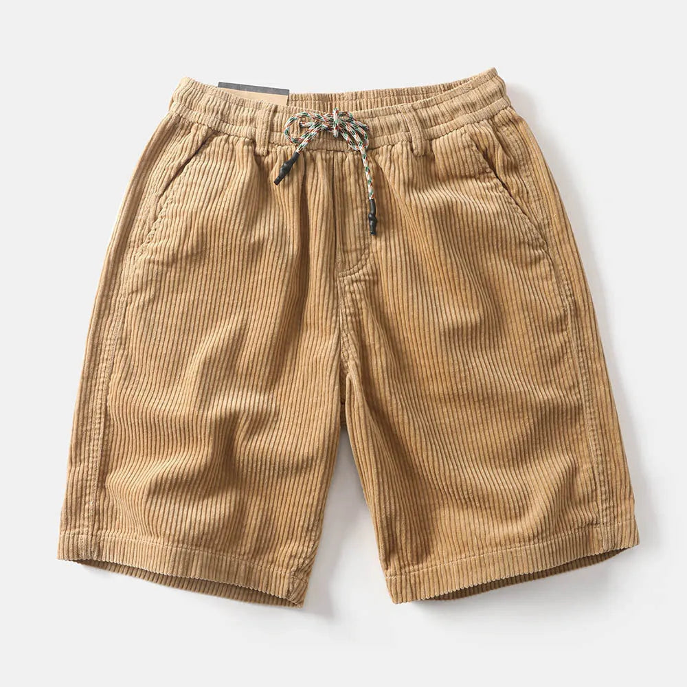 Man wearing khaki retro-style cargo shorts with straight leg and cargo pockets.