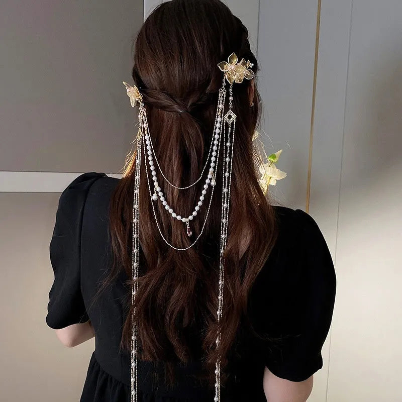 Gold grip acrylic hairpin with white pearl, clear diamond flower, and long beaded tassel decoration.
