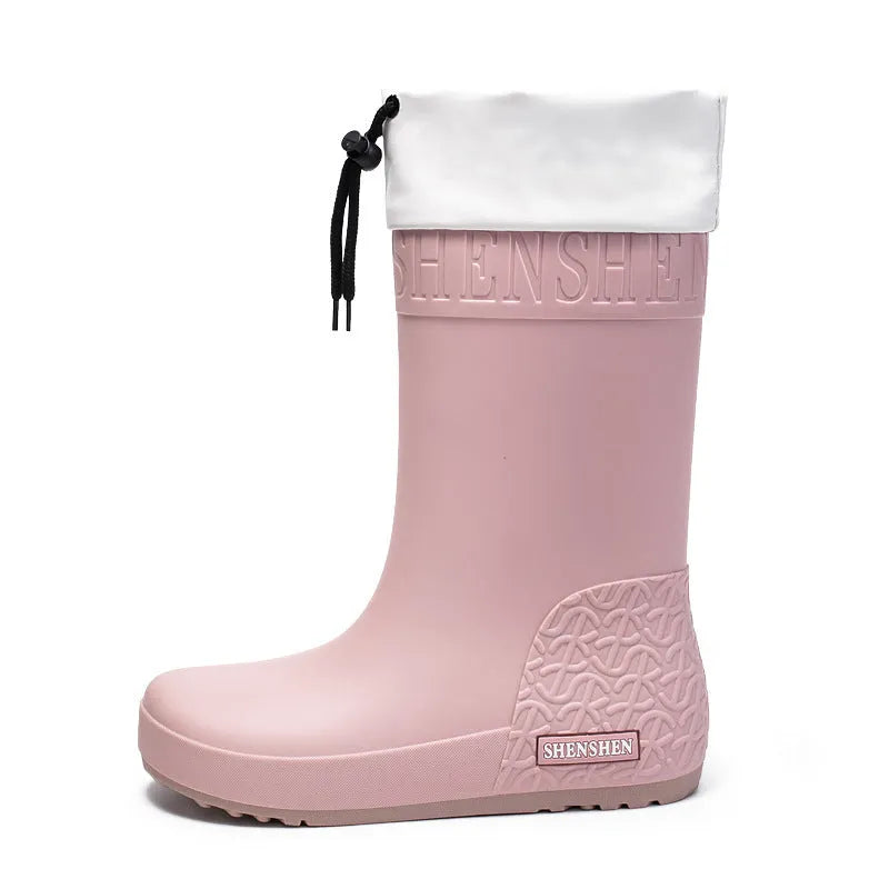 Women's solid colour PVC rain boots with non-slip soles in apricot, black, brown, and pink options