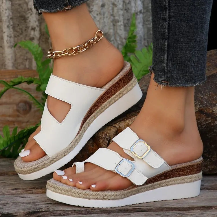 White patent leather wedge sandals with woven upper and finger fit design