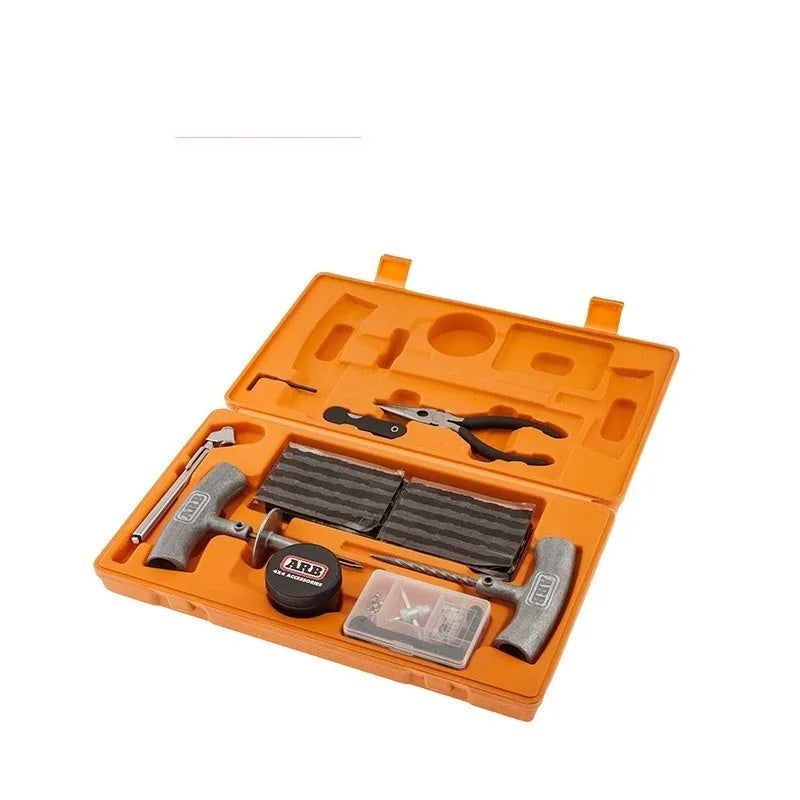 Emergency tyre repair tool set with pressure gauge and reamer tools in high-visibility suitcase