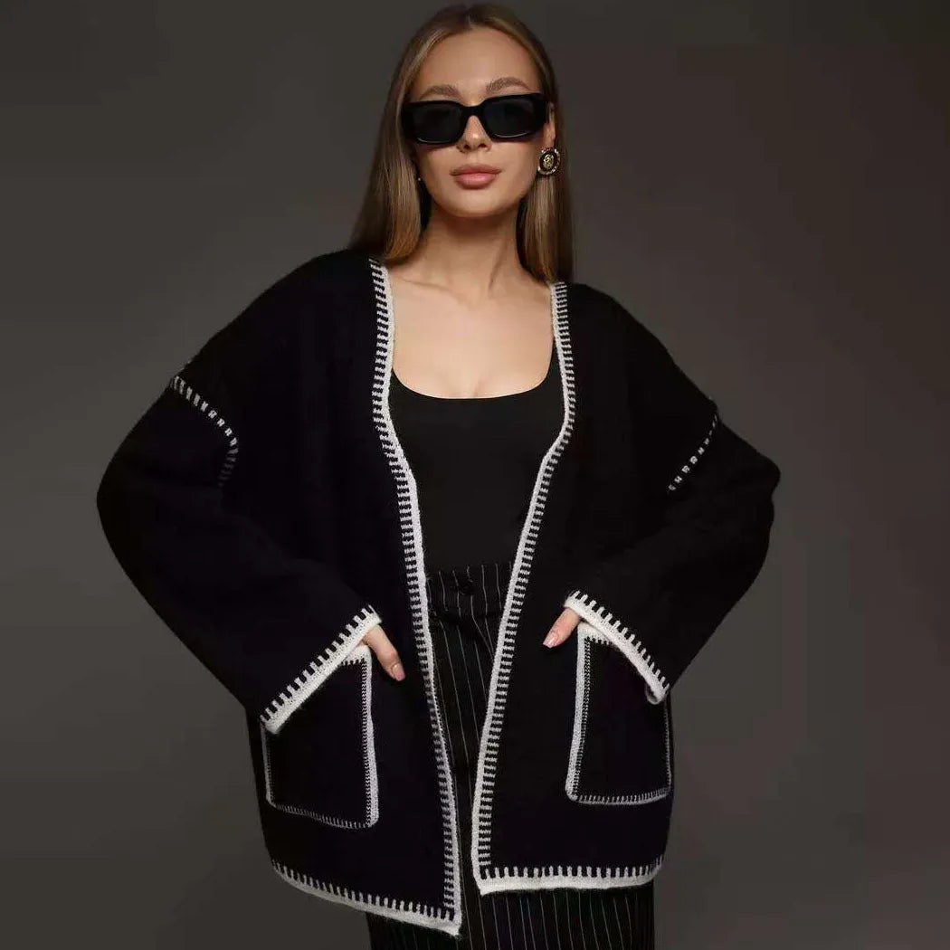 Loose lace-up front knitted cardigan in camel colour, showing mid-length fit and long sleeves.