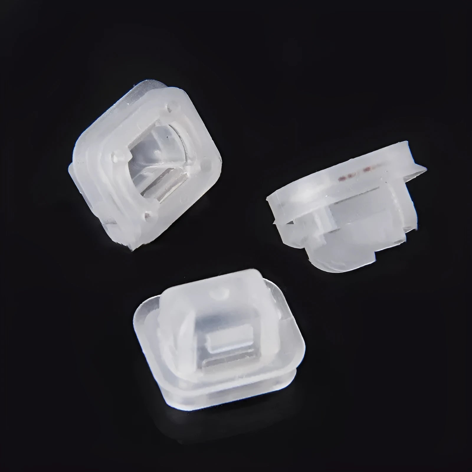 Transparent plastic interior fastener clip for BMW E39 and E38 models showing peach wood design.