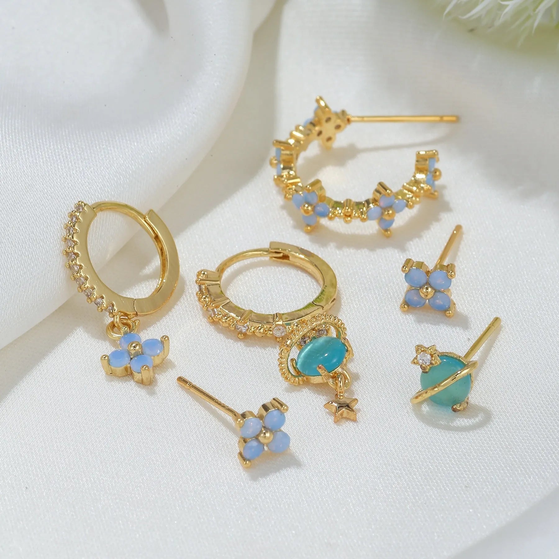 Gold and silver flower stud earrings with zircon detail in Japanese Korean sweet girl style.
