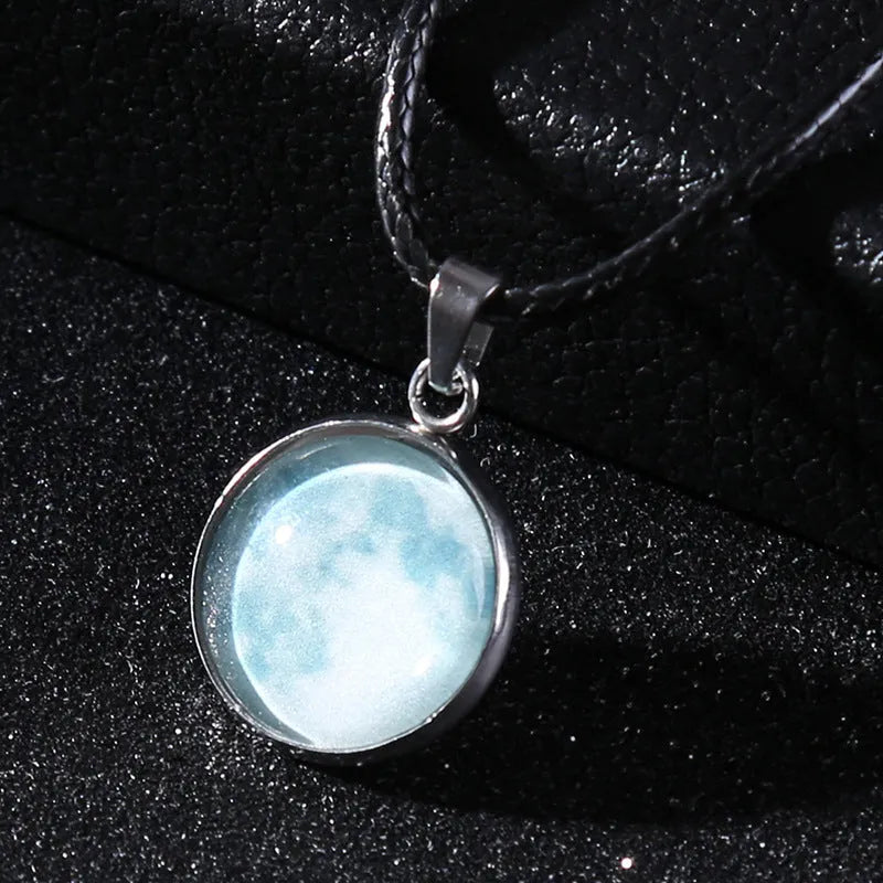 Luminous alloy necklace with a glass pendant depicting a Christmas moon night sky, showing the extension chain.