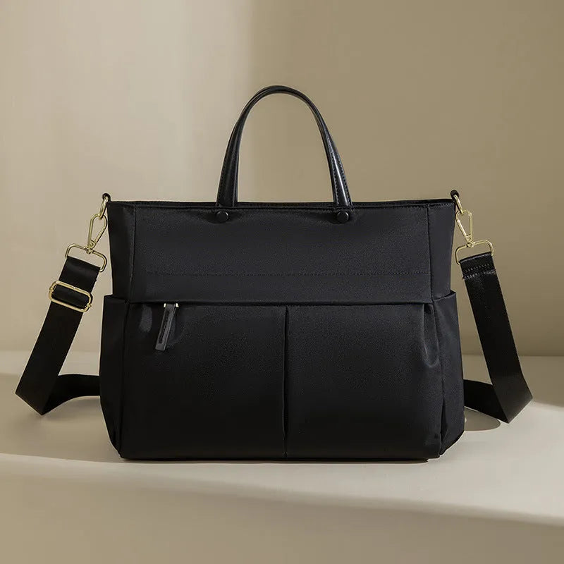 Women's urban simplicity style Oxford cloth laptop briefcase in elegant black with contrast stitching.