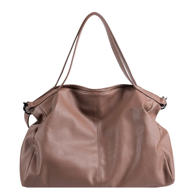 Large soft white PU messenger bag with a long cross-body shoulder strap and zip closure