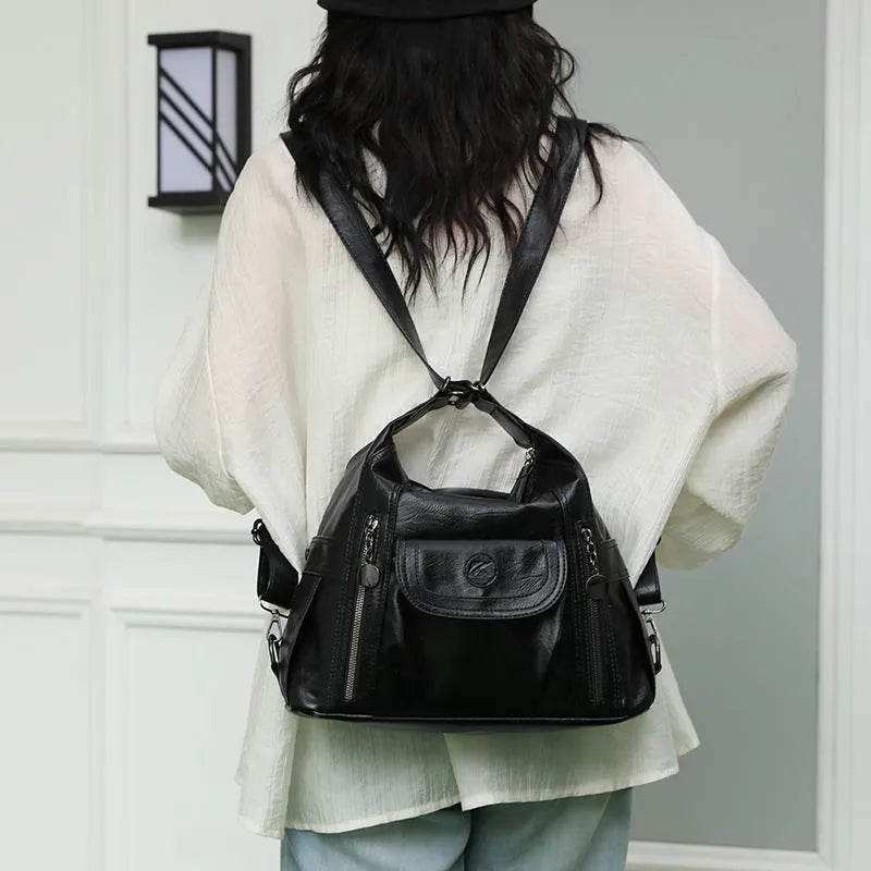 Women's PU leather shoulder messenger bag with zip compartments, available in black, brown or champagne