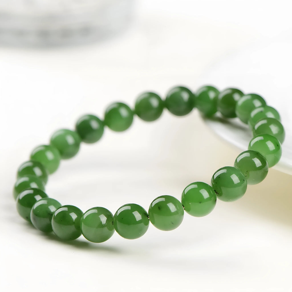 Natural Jasper bead bracelet on Hetian jade string showing polished stones in various sizes.