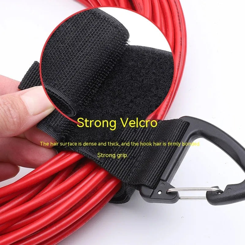 Black heavy-duty storage strap with carabiner hook in three sizes for garage workshop and outdoor use.