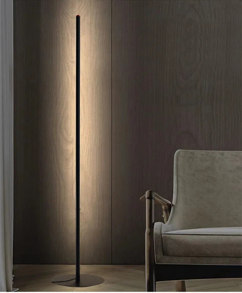 Vertical aluminium floor lamp in modern simple style shown at different heights on a table.