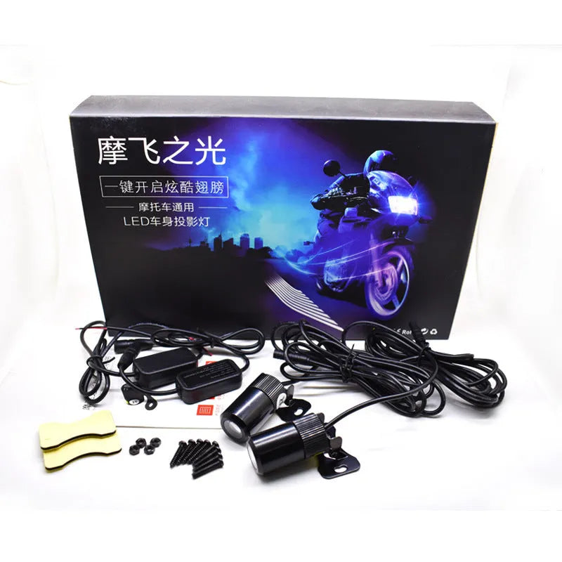 Wings projection LED lamp with aluminium housing and projection lens, for motorcycles and vehicles, available in blue, ice blue, red, or white.