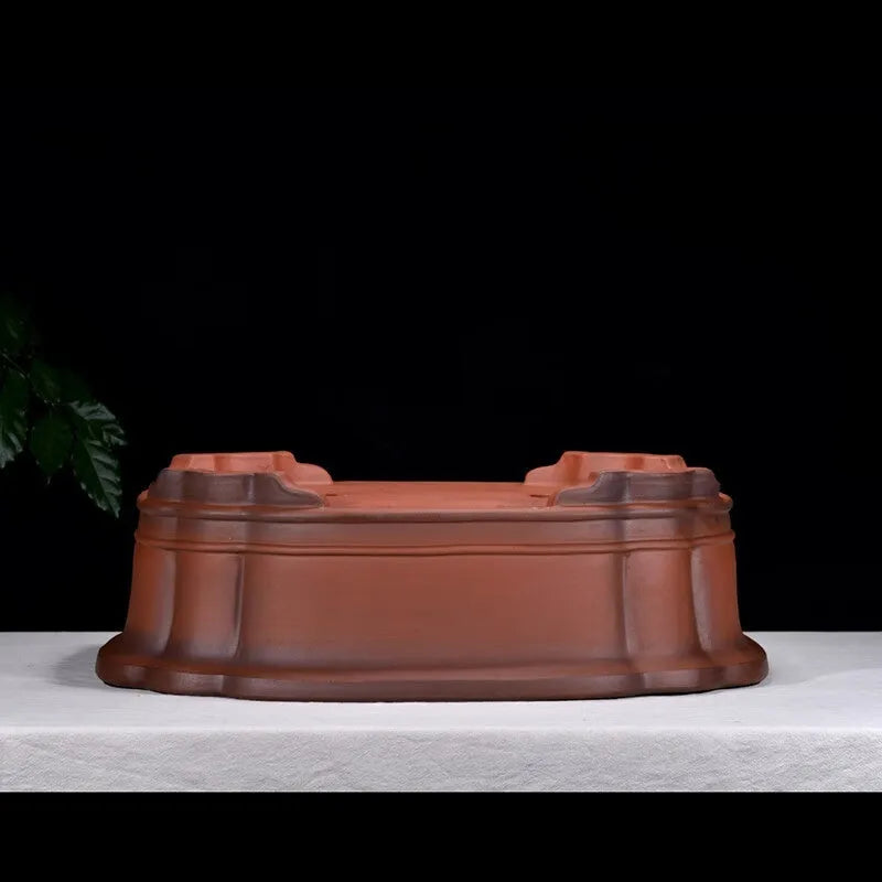 Large antique-finish purple clay Chinese style garden flower pot showing its size and deep planting cavity.