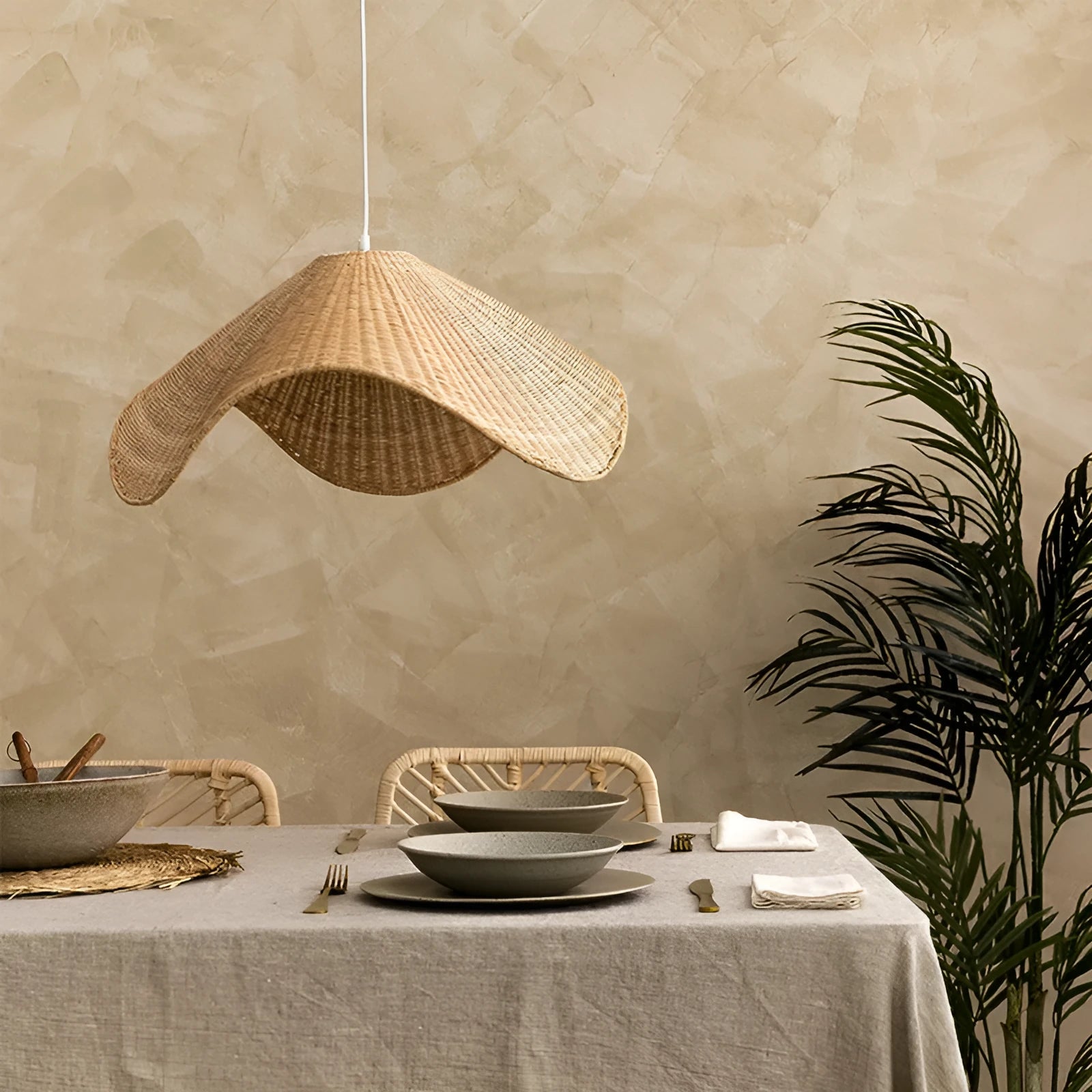 Handmade bamboo and rattan pendant ceiling lamp with a woven willow shade in warm white light.