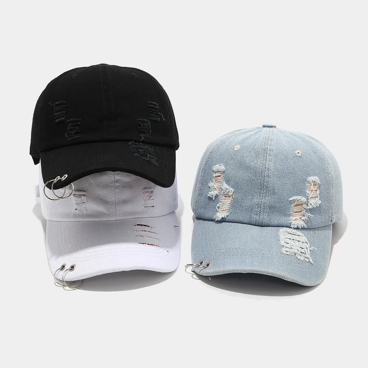 Men's adjustable denim peaked cap in black, shown from the side on a mannequin head