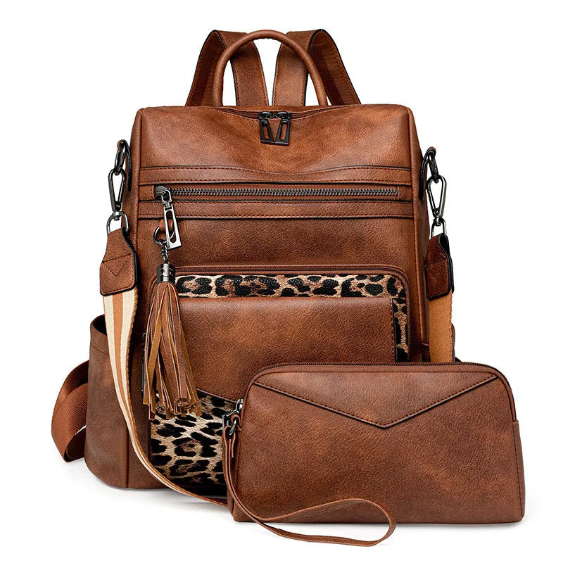 Retro women's backpack with two-tone fringe, soft PU outer, multiple compartments, available in various colours.