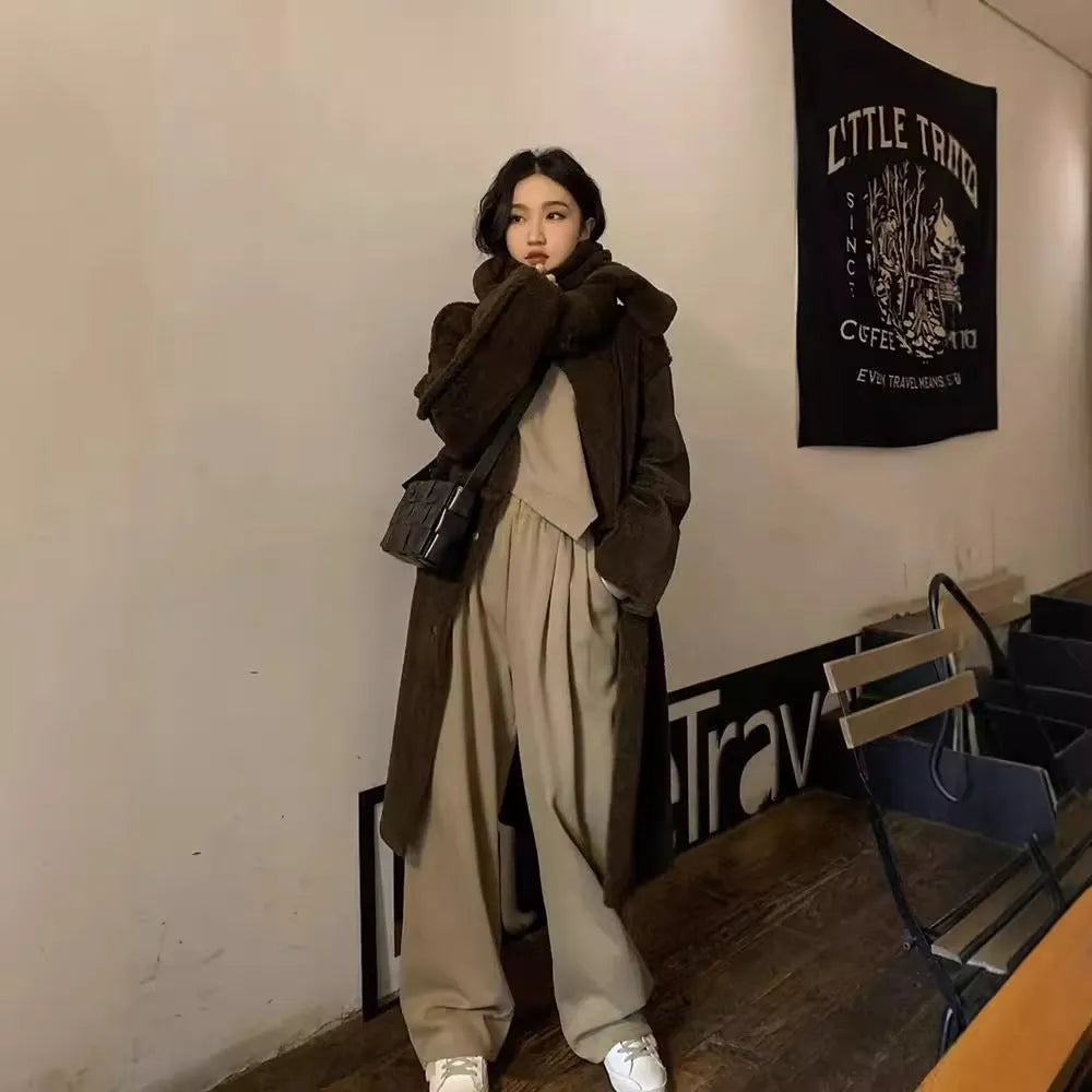 Women's khaki loose-fit casual sports suit with long sleeves and full-length trousers.