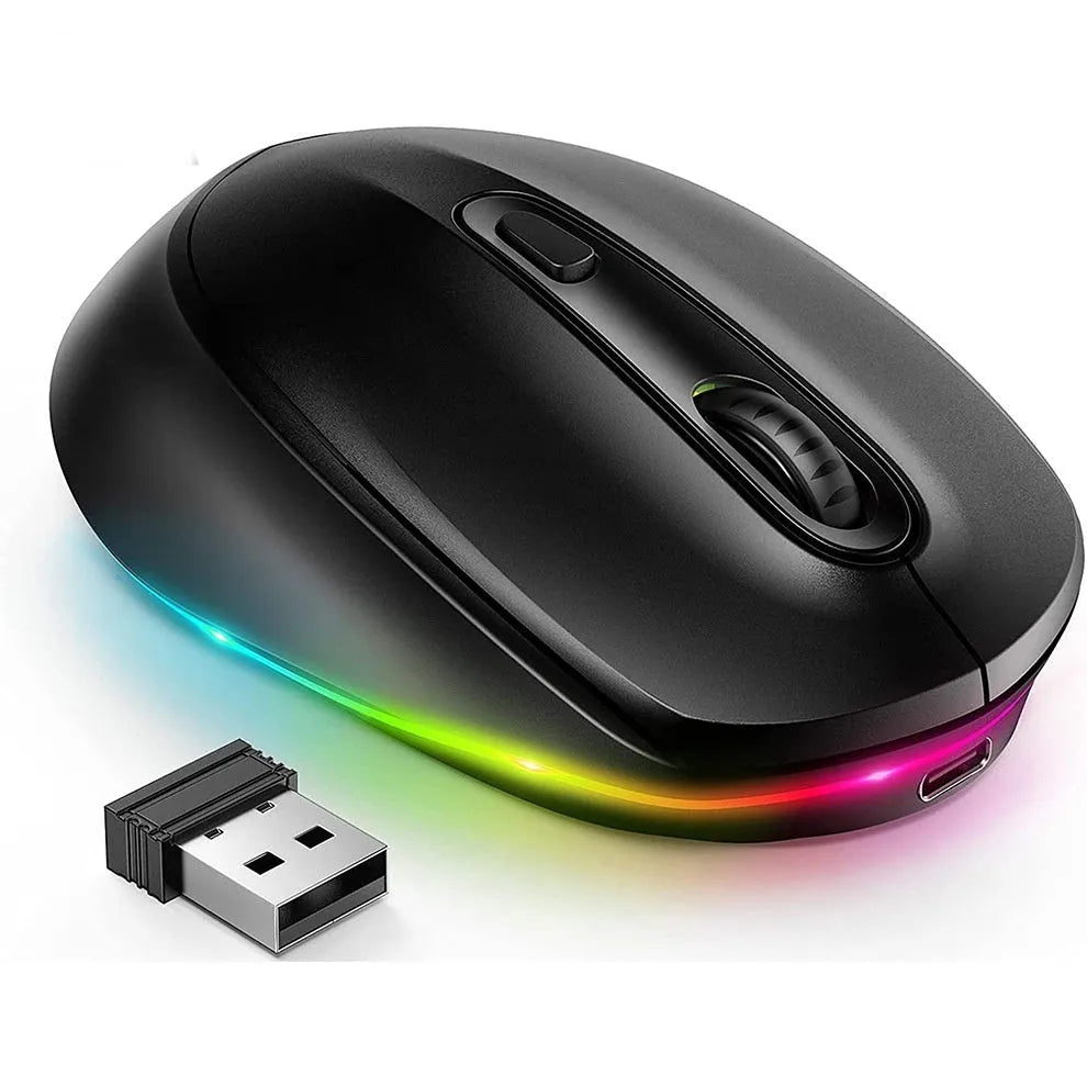 Compact 24g wireless ergonomic mouse with USB charging cable on a desk next to a laptop.